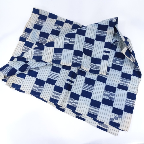 155 - A Ghanian blue and white embroidered geometric design bed cover