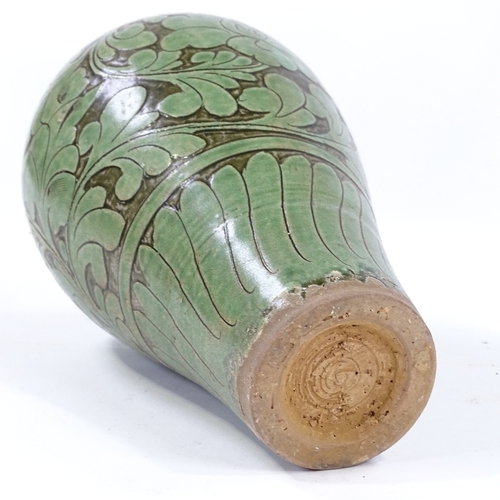 167 - A Chinese green glazed ovoid vase, with incised leaf decoration, height 26cm, and a Chinese blue and... 