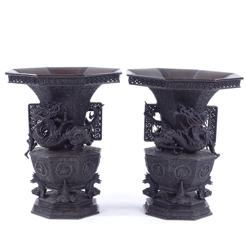 168 - A pair of Japanese Meiji period bronze vases, 3-dimensional dragon mounted necks, with pierced friez... 