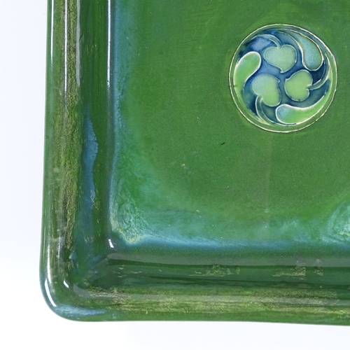 17 - A Moorcroft Flamminian Ware square bowl, with green glaze and stylised central panel, 24cm across