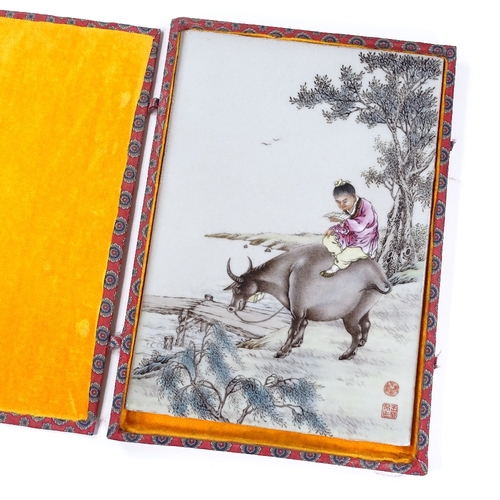 170 - A Chinese porcelain plaque with hand painted scene depicting a figure riding a water buffalo, signed... 