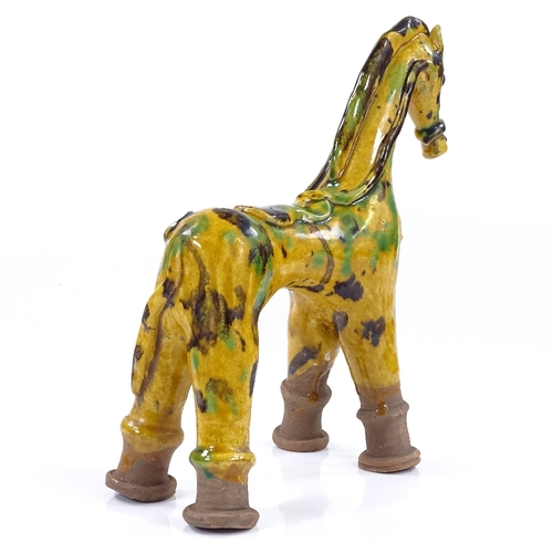 180 - A Turkish yellow glaze Canakkale pottery horse, height 23cm