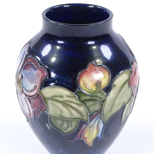 19 - A Moorcroft blue ground Anemone pattern vase, height 12cm