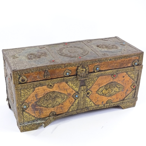 192 - A Tibetan copper and brass covered treasure box, length 39cm