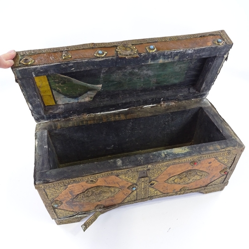 192 - A Tibetan copper and brass covered treasure box, length 39cm