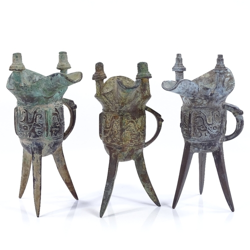 193 - 3 Chinese verdigris bronze Archaic style lamp stands, height 19cm