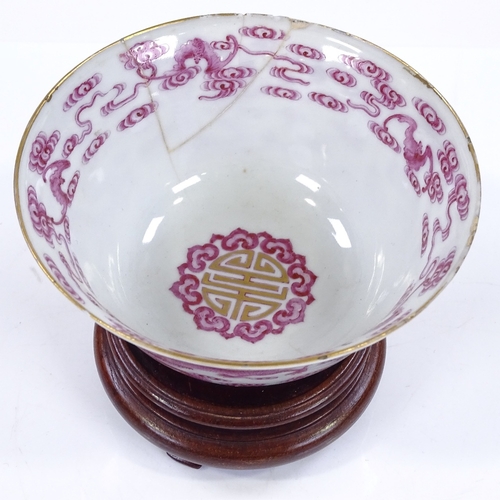 194 - A Chinese porcelain bowl with painted and gilded dragon designs, diameter 11.5cm, A/F