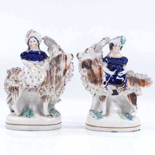 200 - A pair of Victorian Staffordshire figures, girls riding goats, height 13cm