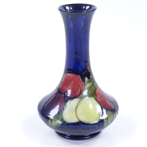 21 - A Moorcroft blue ground Wisteria pattern narrow-necked vase, height 15cm