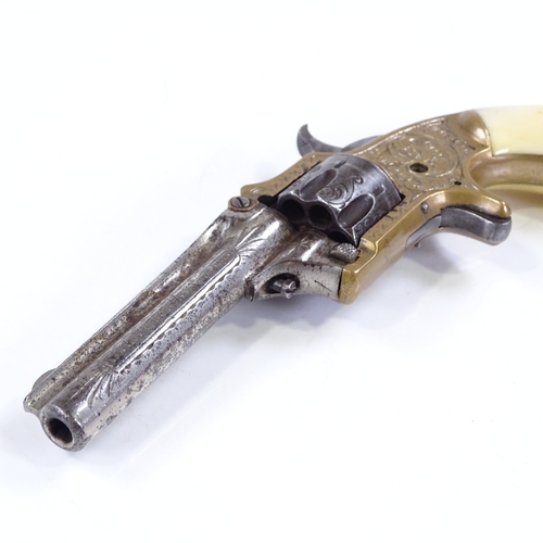 211 - A 19th century XX Standard Revolver, brass and steel with ivory grips, by I J M Marlin of Newhaven, ... 