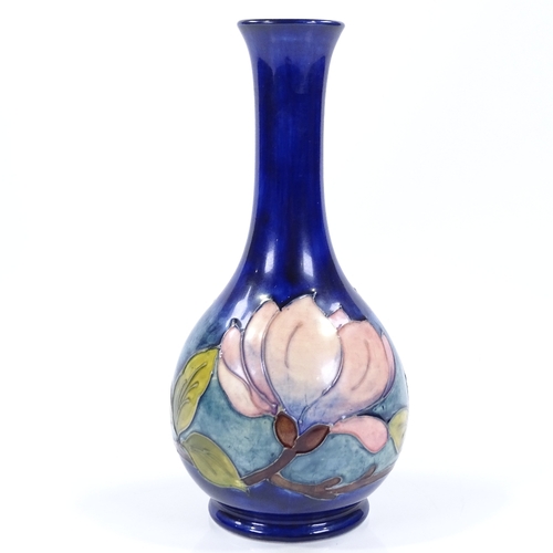 22 - A Moorcroft Magnolia pattern narrow-necked vase, height 21cm