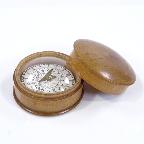 32 - A treen-cased compass/sundial, diameter 5cm