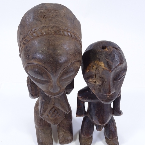 45 - 2 African Tribal carved wood fertility figures, largest height 31cm