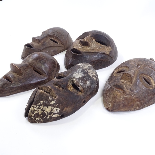 46 - 5 small African wooden masks