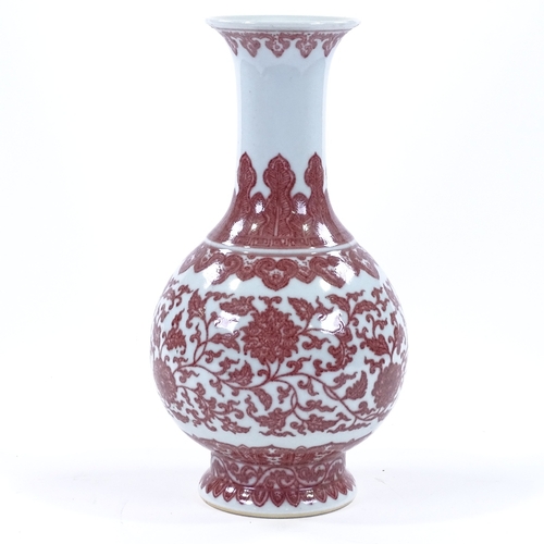 53 - A Chinese white ground porcelain narrow-necked vase, with hand painted iron-red floral decoration, p... 