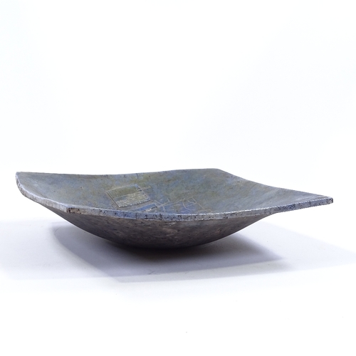 54 - A blue/bronze glaze Studio pottery bowl, with relief abstract decoration, impress maker's monogram, ... 