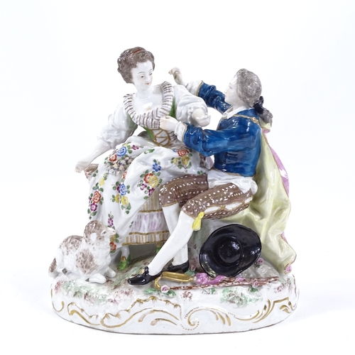 57 - A 19th century German porcelain courting couple group, blue under glaze crossed swords mark, height ... 