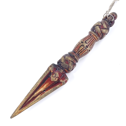 63 - A Tibetan carved and painted wood ceremonial dagger, length 25cm