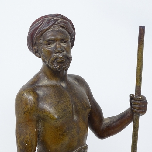 72 - A patinated spelter figure of an Arab man carrying a water flagon, signed on the base, circa 1900, h... 