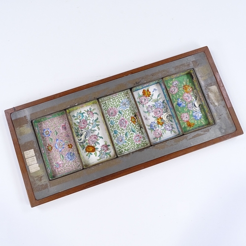 74 - A Middle Eastern coloured enamel metal 5-section hors d'oeuvres set in fitted tray, length 50cm