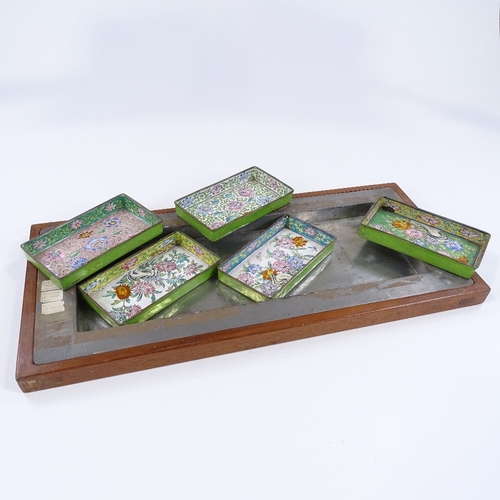 74 - A Middle Eastern coloured enamel metal 5-section hors d'oeuvres set in fitted tray, length 50cm