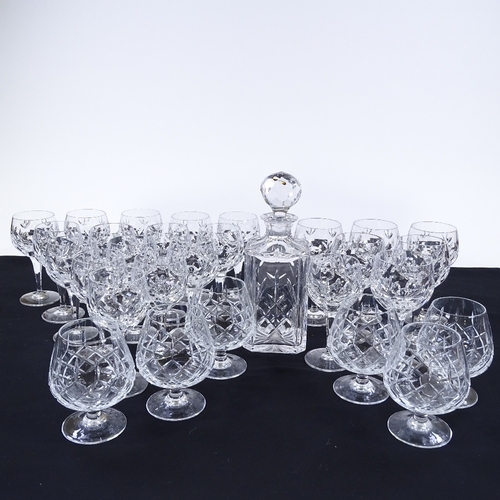 77 - A suite of cut-glass drinking glasses, and a cut-glass decanter (29)