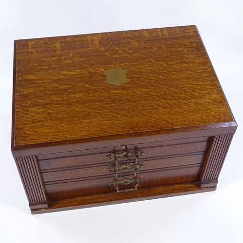 79 - A canteen of plated cutlery and servers for 12 people, with ivory handles, circa 1900, in oak cantee... 