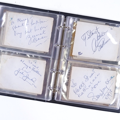 82 - An album of autographs, including Muhammad Ali, Gene Kelly, Fred Astaire, Johnny Weissmuller, Clint ... 