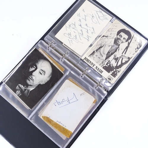 82 - An album of autographs, including Muhammad Ali, Gene Kelly, Fred Astaire, Johnny Weissmuller, Clint ... 