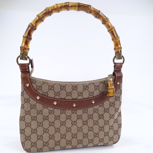 84 - A Gucci handbag with bamboo handle, length 27cm