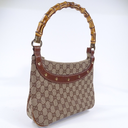 84 - A Gucci handbag with bamboo handle, length 27cm