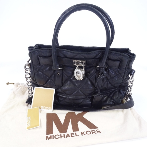 86 - A Michael Kors black quilted leather handbag with dust bag