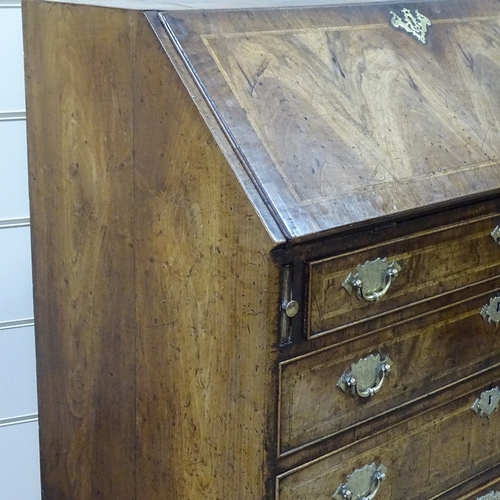 232 - A fine 18th century walnut bureau, with elaborate stepped and drawer fitted interior, 4 long feather... 