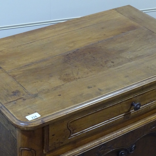 234 - A French cherrywood cupboard, with frieze drawer and carved panelled cupboard below, width 2'10