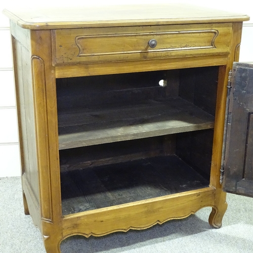 234 - A French cherrywood cupboard, with frieze drawer and carved panelled cupboard below, width 2'10