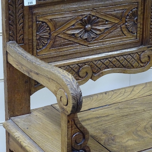 235 - A Victorian light oak hall settle with carved and panelled Arcadian back, length 3'11