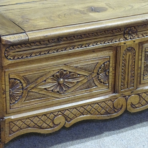 235 - A Victorian light oak hall settle with carved and panelled Arcadian back, length 3'11