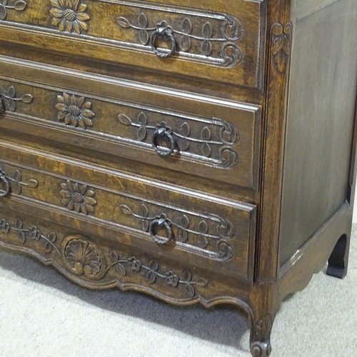 236 - A French oak chest of 3 long drawers, circa 1900, with carved drawer fronts and shaped top, width 3'... 