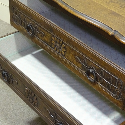 236 - A French oak chest of 3 long drawers, circa 1900, with carved drawer fronts and shaped top, width 3'... 