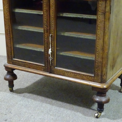 242 - A Victorian walnut and parquetry-banded music cabinet, with brass galleried top and glazed cupboards... 