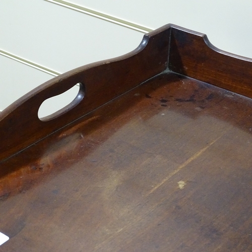 243 - A Georgian mahogany butler's tray on folding stand, 30