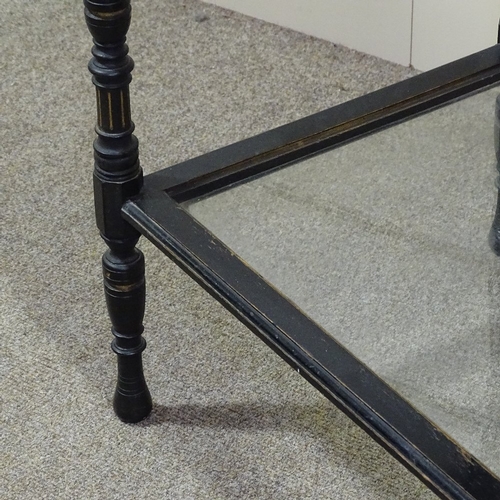 245 - A 19th century ebonised vitrine table, width 23