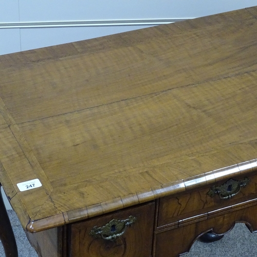 247 - An 18th century walnut lowboy with feather-banded top, 3 frieze drawers with shaped apron and cabrio... 