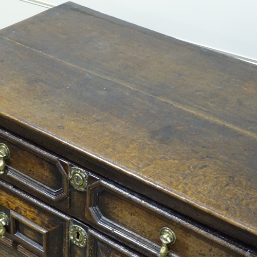 248 - A Jacobean joined oak chest of 4 long drawers in 2 parts, with fielded moulded drawer fronts, brass ... 