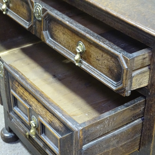 248 - A Jacobean joined oak chest of 4 long drawers in 2 parts, with fielded moulded drawer fronts, brass ... 