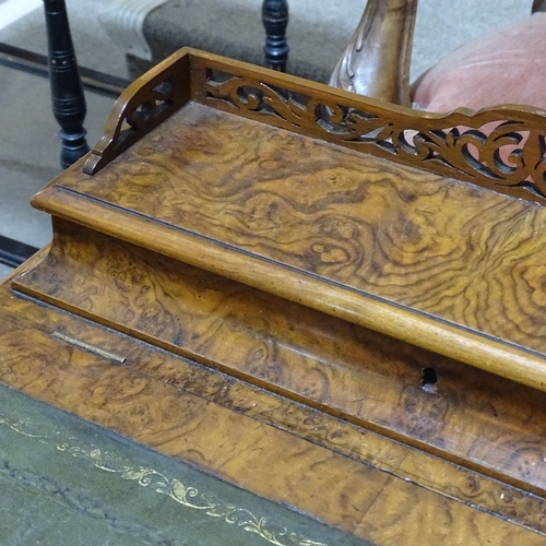 253 - A Victorian walnut Davenport with carved cabriole supports