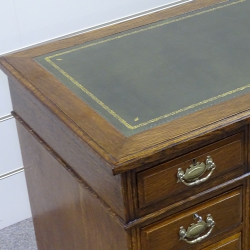 257 - A Victorian oak pedestal desk, with green leather top and brass drop handles, 3'6