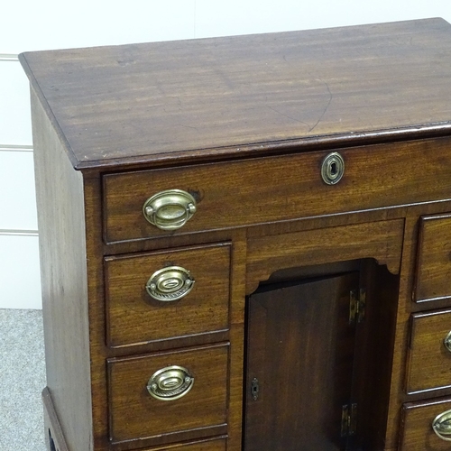 258 - A George III mahogany kneehole writing desk of small size, with drawers and alcove cupboard, width 2... 