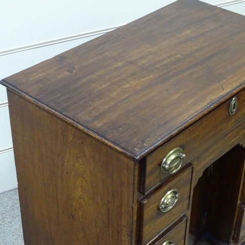 258 - A George III mahogany kneehole writing desk of small size, with drawers and alcove cupboard, width 2... 