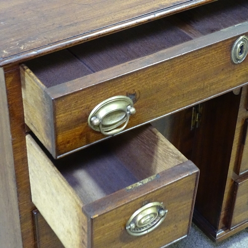 258 - A George III mahogany kneehole writing desk of small size, with drawers and alcove cupboard, width 2... 